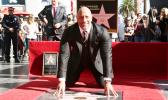 Dwayne Johnson poses for a photo at his star ceremony at the Hollywood Walk of Fame on Wednesday, Dec. 13, 2017, in Los Angeles. (Photo by Willy Sanjuan/Invision/AP) 