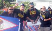 Tanu (Utulei), Charles (Manu’a/Ili’ili), Tau (Manu’a/Atu’u), and Duffy (Manu’a/Petesa) with the American Samoa flag