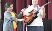 Tapa’au Dr. Dan Aga playing the guitar