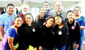 Miss ASCC Grace Lagai (front, far left) and members of the judging panel congratulate the Samoana High School students 