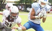 The Most Valuable Player of the Game, Elliot Lelei storming towards the end zone to score the first touchdown for Samoana High School — late in the second quarter — which tied up the ball game at six a piece, during the ASHSAA Football Championship game, last Saturday. Lelei also kicked the field goal to give the Blue Empire the 7- 6 lead, which they held throughout the match for their 1st ASHSAA Varsity football championship in 8 years. The Sharks also won the JV division this year.  [photo: TG]