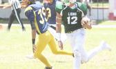 Raymond Paulo, the ‘Iron Man’, taking his second touchdown catch to the end zone – Leone’s second touchdown of the game during the opening half of their varsity match up against the Wildcats last Saturday afternoon. Paulo led the Lions to a 32-0 victory over Nu’uuli.  [photo: TG]