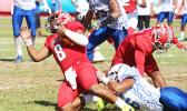 Vito Kitiona of the Vikings is sacked in the backfield by a Samoana defender, during the second quarter of their playoff game this past Saturday at the Veterans Memorial Stadium. The Vikings lost to the Sharks 19-16. [photo: TG]