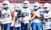 Samoana Sharks' defensive unit coming back on the field after a time out during their playoff game last Saturday at the Veterans Memorial Stadium. Samoana’s defensive unit led the way to a 19-16 victory over the Vikings and they will face the Warriors in the title game of the year this Saturday. [photo: TG]