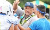 Samoana High School principal Tupa’i Rod Atafua encouraging the Sharks in a time-out during the championship game against the Warriors last Saturday morning, where the Blue Empire claimed this year's title with a narrow 7-6 win. [photo: TG]