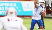 Anthony Feala of the Sharks firing a receiver screen pass out to Zephaniah Pati, during the third quarter of their varsity championship game against the Warriors. Feala and the Sharks claimed this year's ASHSAA title after a 7-6 win over Tafuna last Saturday morning.  [photo: TG]