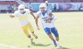 Samoana Sharks' JV Quarterback, Junior Tanielu racing towards the goal line for his first touchdown of the season – a quarterback keep in the second quarter. [photo: TG]