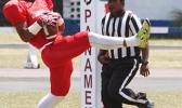 Pitonu’u Ah Sue securing the two-point conversion catch in the end zone during the opening half of a varsity game between Faga'itua and Leone last Saturday. Ah Sue helped the Vikings win 50-20  [photo: TG]