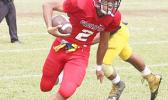 receiving a pass from Kitiona for a two-point conversion, in the second half of their Varsity game against Nu’uuli. The Vikings claimed their second victory of the season with 53 unanswered points this past Saturday.  [photo: TG]