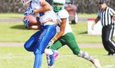 Sam Mikaele of Samoana securing a catch and heading towards the end zone to score the opening touchdown of the game against the Lions last Saturday morning. Mikaele helped the Sharks to a 34- 6 victory over Leone. [photo: TG]