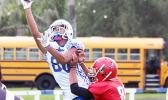 Avery Seumanutafa of the Sharks going up high for the one handed catch during Samoana's two point attempt in the opening quarter of the game. The attempt was called back by officials based on a ruling that his feet were out of bounds.  [photo: TG]