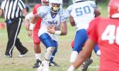  The No.1 ranked quarterback in the ASHSAA JV Division, Jr. Tanielu storming through midfield with a tuck and run play after not finding an open receiver, during the first half of their JV match up against the Vikings last Thursday evening. Tanielu led the Sharks to a ‘Back-2-Back’ Championship title after beating Faga’itua 20-6. [photo: TG]