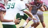 Koison Ozu (#1) of Tafuna dancing through midfield, and looking towards the goal line as he runs an 88-yard reception all the way to the end zone for the opening touchdown during a JV game against the Lions. Ozu led the Warriors to a 34-22 victory.  [photo: TG]