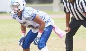 Daniel McMoore, the heart of Samoana’s defensive unit reading a motion by the Vikings offense during the second quarter of their JV game last Saturday morning. McMoore led the Sharks to a near shut out of the Vikings in their 32 - 6 victory.  [photo: TG]