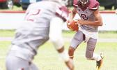 Francisco Mauigoa of Tafuna rolling out with the ball, and locking on to his receiver Pa’apa’a Mauigoa, during the first quarter of their JV match up against the Vikings last Saturday morning. The Warriors won 24-0.  [photo: TG]