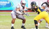 One of Tafuna’s key players, AJ Talafu, a Junior Offensive Lineman from Nu’uuli dropping on a pass block against Dennis Enoka of NVTHS during a varsity match up last Saturday morning. Talafu helped the Warriors to a 38-12 victory against the Wildcats.  [photo: TG]