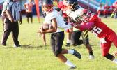 Isileli of the Wildcats at midfield trying to evade a touchdown saving tackle by O’Neil of the Vikings during the opening half of their JV game last Thursday evening. Isileli helped the Wildcats to their first win of the season after beating Faga’itua 14-6. [photo: TG]