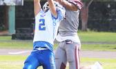 Fitu Amani intercepts a pass from Mauigoa inside the end zone – literally going up for the grab and taking it away from Pa’apa’a Mauigoa for a touchback - during the opening quarter of their JV match last Saturday morning. Amani helped the Sharks to a 8-6 win. [photo: TG]