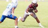 Pa’apa’a Mauigoa of the Warriors trying to make a move against a Samoana defender during their JV match up last Saturday – the Warriors lost for the second time this regular season to the Samoana Sharks, this time by two points 6-8. [photo: TG]