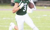 Iverson Ta’ase of the Lions running the ball downfield for the Lions, during the opening half of their varsity match up against Tafuna. Ta’ase led the Lions to a 44-26 win over the Warriors.  [photo: TG]