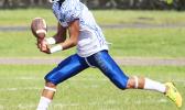 Fitu Amata catching the opening touchdown pass of the game, early in the first quarter of their match up against the Nu’uuli Wildcats last Saturday morning at the Veterans Memorial Stadium. Amata led the Sharks to a 28-2 victory over the Wildcats.  [photo: TG]