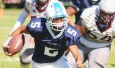Fitu Amata Jr. of Samoana carrying the ball
