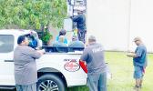 Crews work on siren system