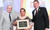 Edna Noga (middle) accepting for ASPA, the American Public Power Association Community Service Award