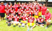 The AYFS Red All Star Team led by Head Coach Kirifi Ofagalilo (bottom right) posing for a team photo after defeating the AYFS Blue All Star team in a stunning 14-8 comeback victory last Saturday at the Veterans Memorial Stadium. (See tomorrow's Samoa News issue for the Red and Blue All-Star Game story and more photos) [photo: TG]