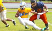 Sam Mikaele of the Rams is stopped immediately in the backfield by Foalima Tatupu of the Bears during the opening half of their championship match up last Saturday. [photo: TG]