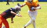 After securing a catch in the second half of play, Sam Mikaele is caught trying to stiff arm the last defender between him and the end zone to score his first touchdown of the game during the second half of play.  [photo: TG]
