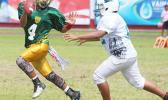 AYFS Packers quarterback Alfred Maiava trying to escape the rush from a Panthers defender early in the opening quarter of their match up last Saturday morning. Maiava led the Packers to a 32 - 6 victory, their second win of the season.  [photo: TG]