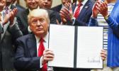 In this April 28, 2017, file photo, President Donald Trump holds up a signed Executive Order in the Roosevelt Room of the White House in Washington directing the Interior Department to begin review of restrictive drilling policies for the outer-continental shelf. The AP reported on May 26, 2017, that a story shared by the St. George Gazette website claiming Trump signed an executive order allowing the hunting of bald eagles is a hoax. (AP Photo/Pablo Martinez) In this April 28, 2017, file photo, President Donald Trump holds up a signed Executive Order in the Roosevelt Room of the White House in Washington directing the Interior Department to begin review of restrictive drilling policies for the outer-continental shelf. The AP reported on May 26, 2017, that a story shared by the St. George Gazette website claiming Trump signed an executive order allowing the hunting of bald eagles is a hoax. (AP Photo/Pablo Martinez)