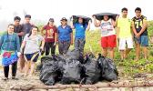 Young people with bags of rubbish picked up