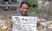 Tuvalu child with sign