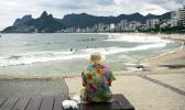 An elderly woman watches Arpoador beach in Rio de Janeiro, Brazil, March 17, 2020