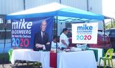 Local supporters for US democratic presidential hopeful, billionaire businessman Mike Bloomberg at their campaign booth.