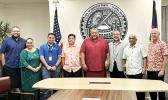 Gov. Lemanu P.S. Mauga and ASG staffers in a group photo with personnel from Bluesky and its parent company