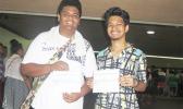 Two participants of the Summer Youth Employment Program smiling as they receive their first paychecks which were disbursed yesterday afternoon inside the EOB atrium. [photo: Sabrina Sinapati]