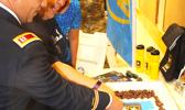 US Army Capt. Kurk Cruz Diaz, the Guam Recruitment Company Commander, with Bluesky official Sherry Sele, cutting the cake yesterday as part of the signing ceremony for the Army Partnership for Youth Success (PaYS) program with Bluesky Communications.  [photo: FS]