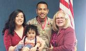 Capt. Paunga with his wife, mother and son
