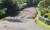 emporary fix -with gravel and cinder - filling the now gone large potholes on the Cardinal Pio Road