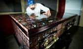 Artist and signage Specialist Pomare Amosa with one of the caskets he has decorated. Photo / Dean Purcell Artist and signage Specialist Pomare Amosa with one of the caskets he has decorated