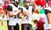 Andrew Toilolo celebrating with teammate Niles Tuamoheloa after Toilolo scored a 2-point conversion in the first half of their championship match against the Vikings last Saturday. [photo: TG]