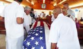 Pallbearers escorted into the Futiga Catholic Church last Thursday during the family service, the U.S. flag-draped coffin of Ulufaleilupe Fuimaono Ta’aala Leulua'ialii Filifaiesea Fa'asuamalie
