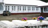 It was clear during the press conference that it’s the wish of Task Force chair, Lt. Gov. Talauega E.V. Ale that families be allowed to hold funerals for their loved ones while at the same time the public is protected from the community spread of the virus. graves near a house and church