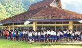 This photo taken yesterday and provided by the local Department of Education shows students at Peter Coleman Elementary School in Pago Pago lining up outside of a school building before the start of school yesterday. All public schools re-opened yesterday.  [photo: ASDOE]