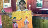 Katie Jewel Godinet with her artwork