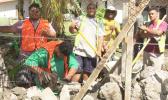 CJ Construction crew building a rock wall