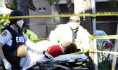Firefighter continuing CPR on police shooting victim